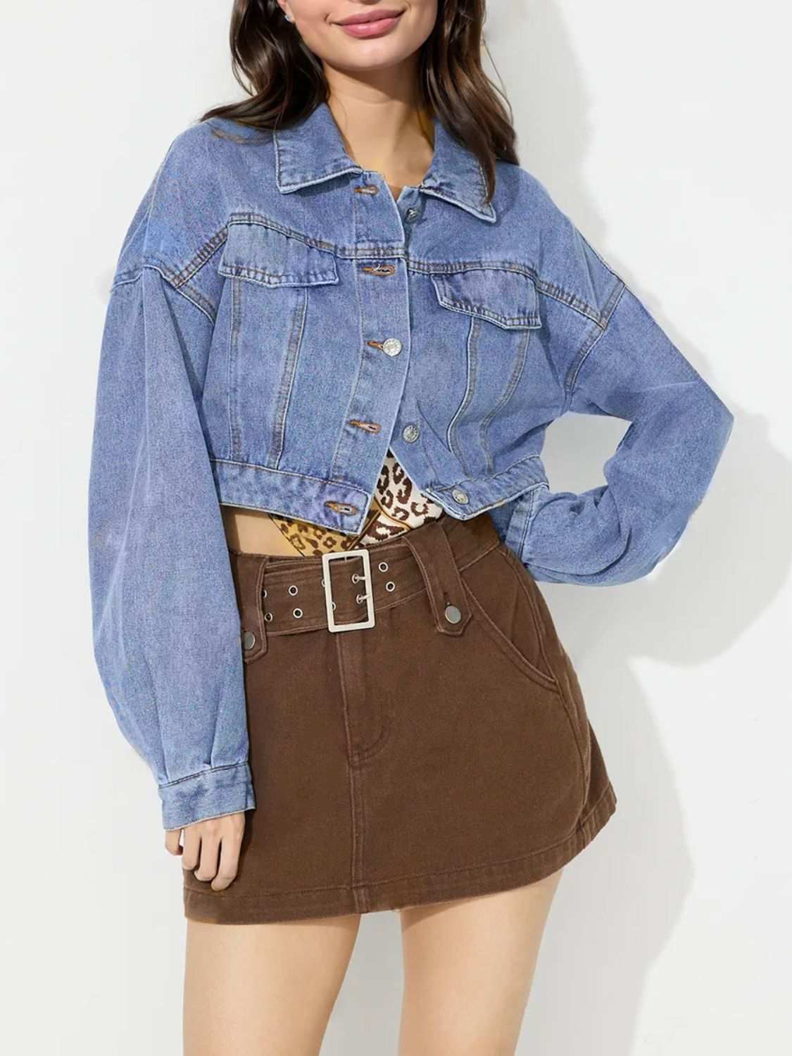 Collared neck dropped shoulder cropped denim top with buttoned front.