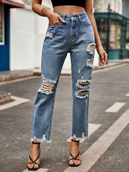 Distressed raw hem jeans with pockets and button closure.