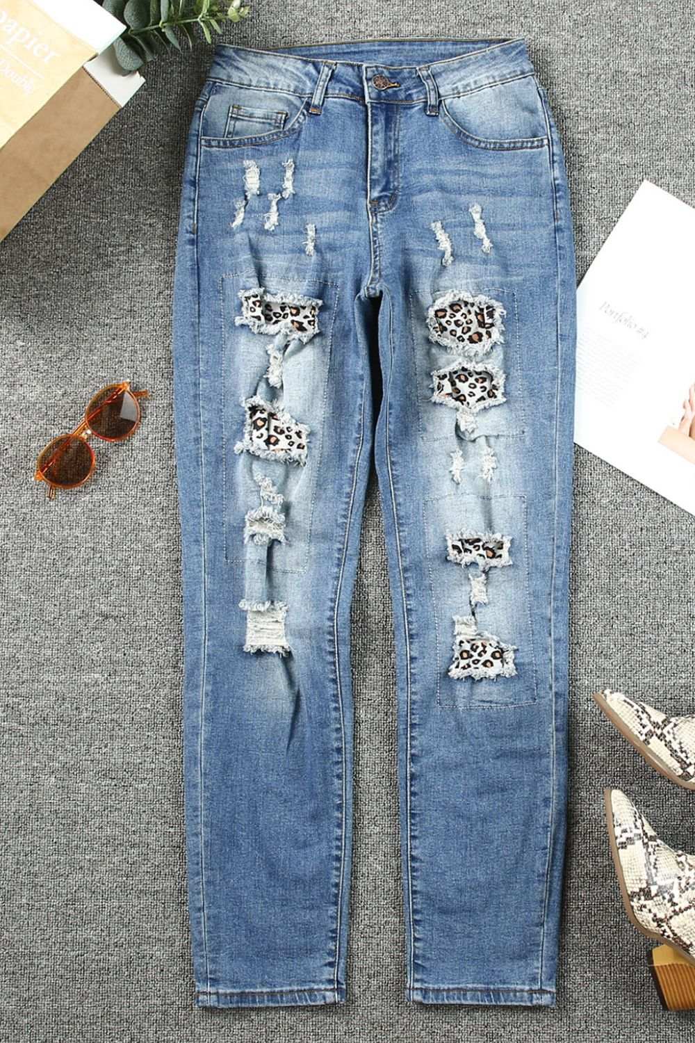 Leopard Distressed Pocketed Straight Jeans with ripped details and leopard pattern patches.