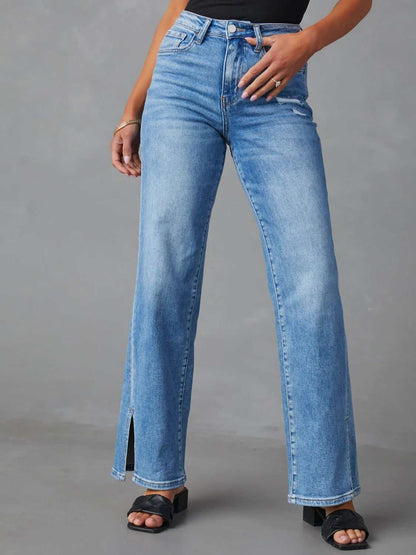 Slit buttoned jeans with pockets in light blue denim featuring moderate stretch.