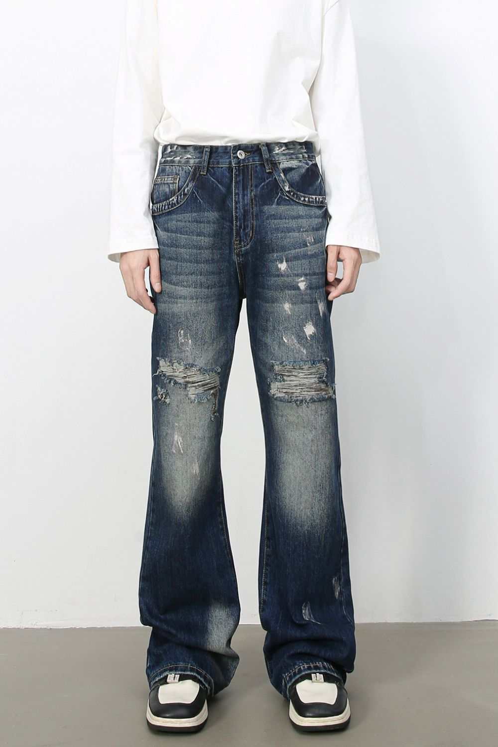 Men's distressed jeans with no stretch, made from cotton, viscose, and polyester blend.