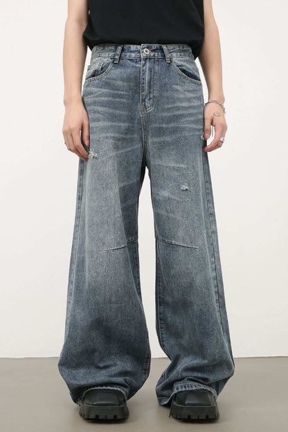 Men's distressed wide leg jeans with slightly stretchy denim.
