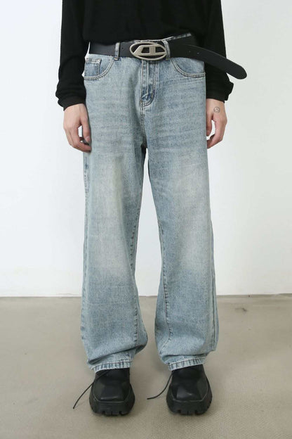 Men's loose fit jeans with no stretch, light blue wash, basic style.