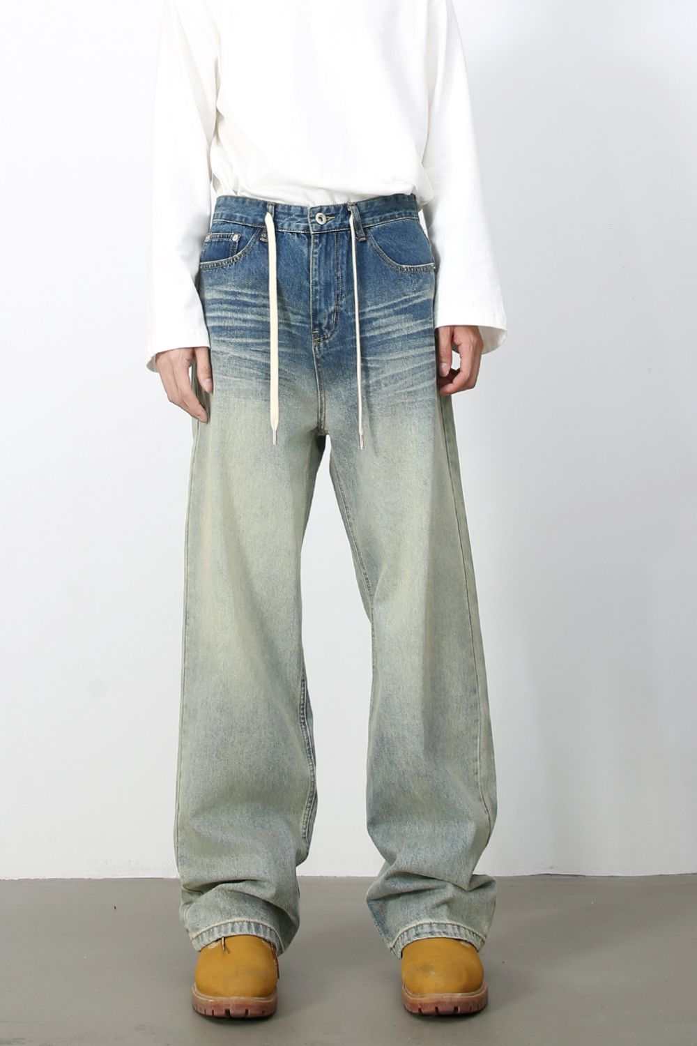 Men's loose fit jeans with drawstring and pockets, non-stretch cotton blend.