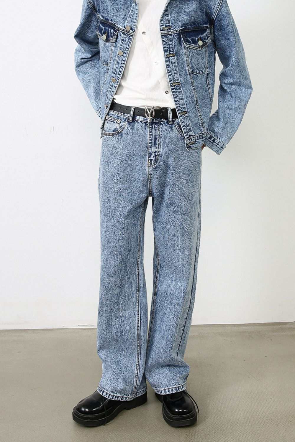 Men's straight leg jeans with no stretch, 88.4% cotton, styled with a denim jacket.