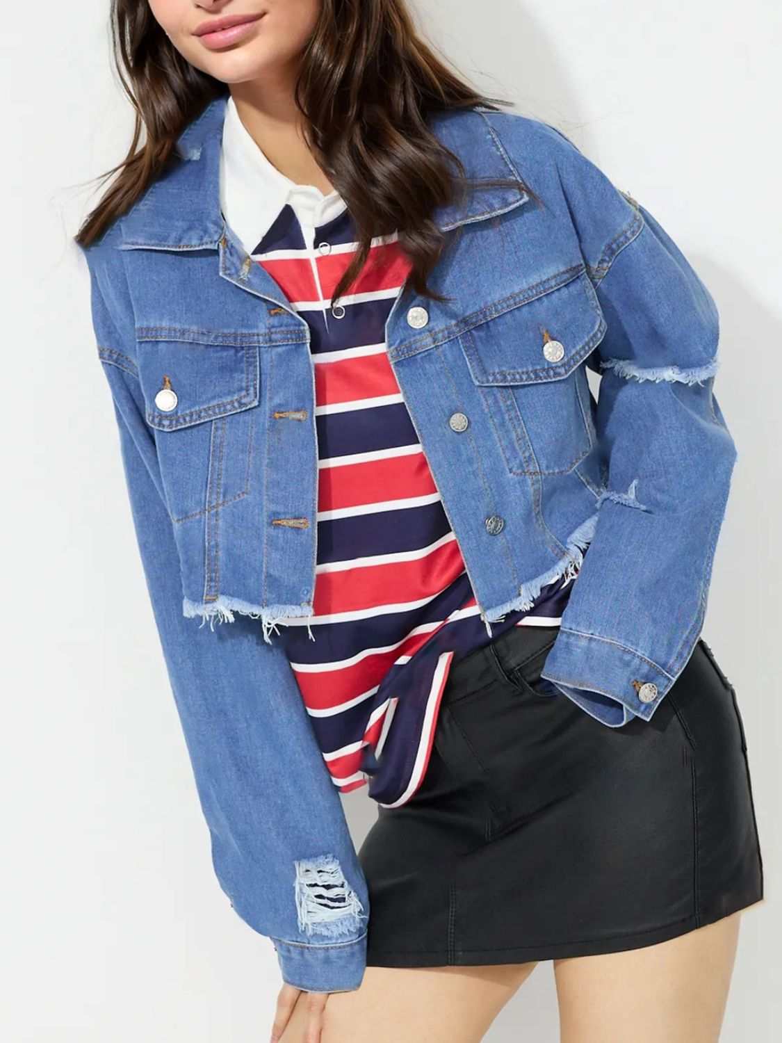 Cropped denim top with raw hem and collared neck.