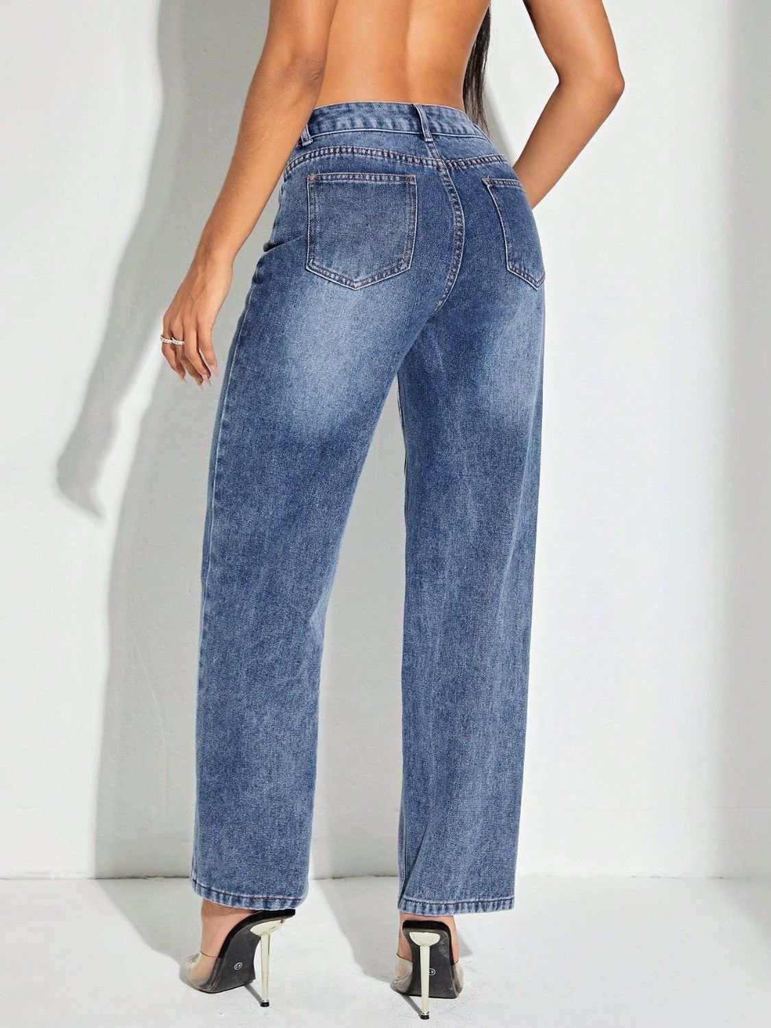 Contrast patchwork straight jeans with pockets, slightly stretchy, back view.