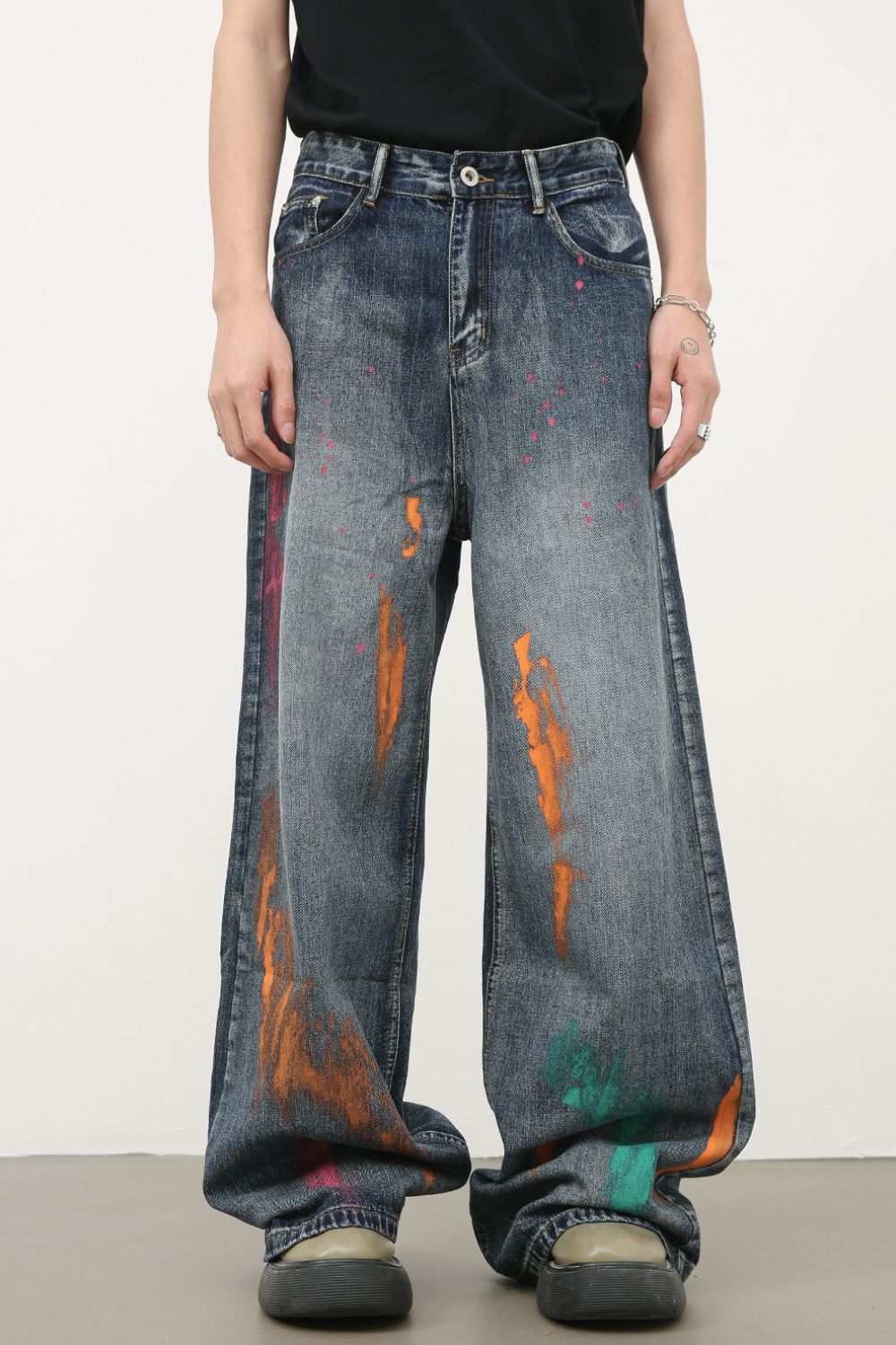 Men's splash print wide leg jeans with colorful paint splatter design.