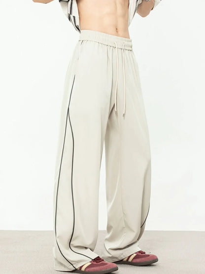 Men's contrast straight sweatpants with black piping, polyester-spandex blend.