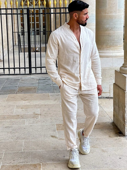 Men's button up long sleeve top and pants set in white cotton.