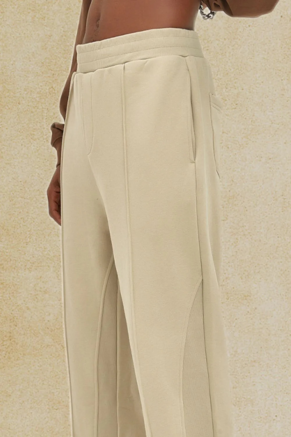 Men's elastic waist pants in beige, basic style, made from cotton and polyester blend.
