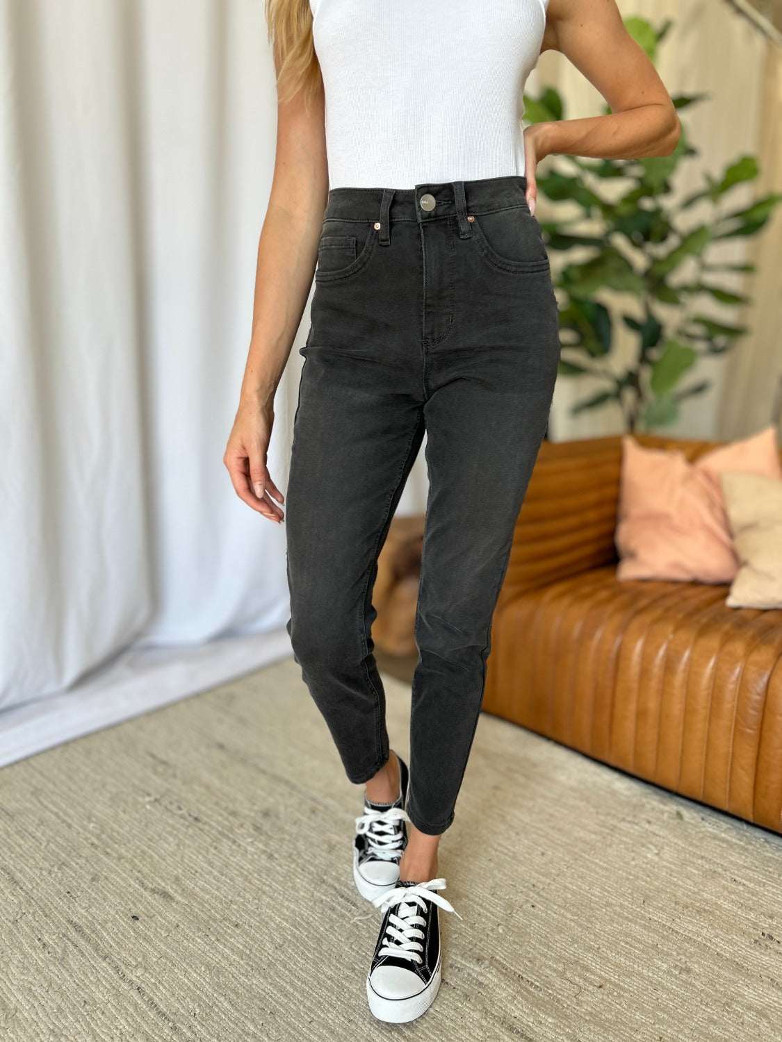 High rise tummy control skinny jeans offering a sleek fit and elongated leg appearance.