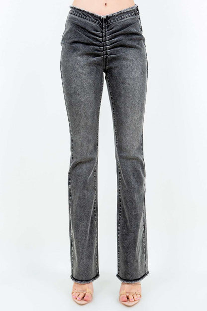 American Bazi V-cut ruched flare pants in gray, featuring a mid-flare design and side zipper closure.
