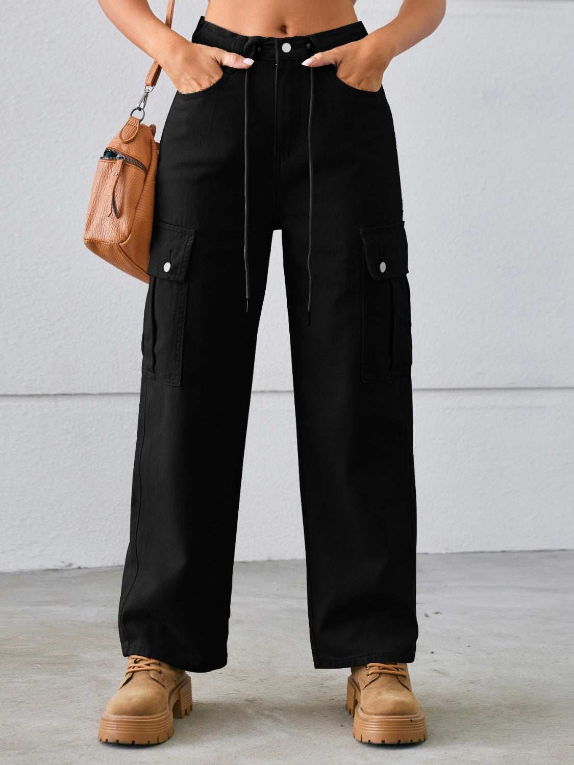 Drawstring mid-rise waist straight cargo jeans with pockets, no stretch.