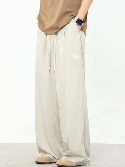 Men's plus size drawstring wide leg pants in light grey, featuring a basic style and machine washable polyester-spandex fabric.