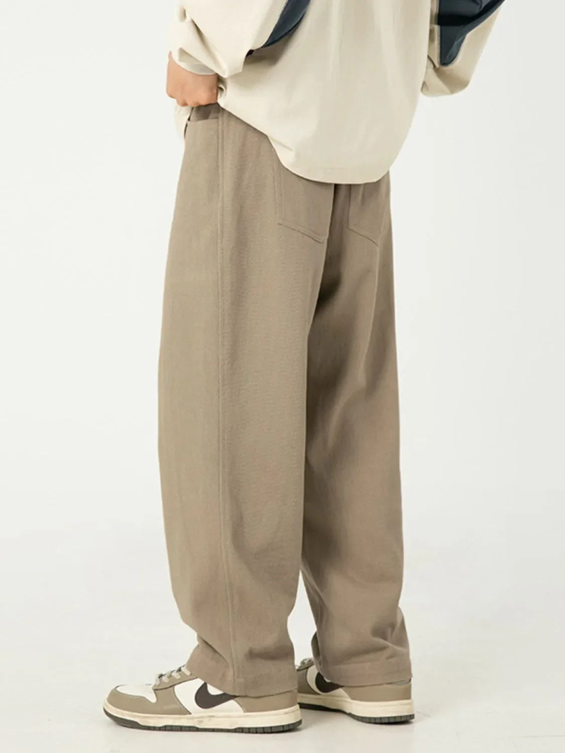 Men's full-size wide leg pants in beige, 100% cotton, basic style.