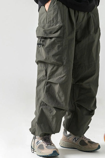 Men's plus size elastic waist pants with pockets, nylon material, casual style.