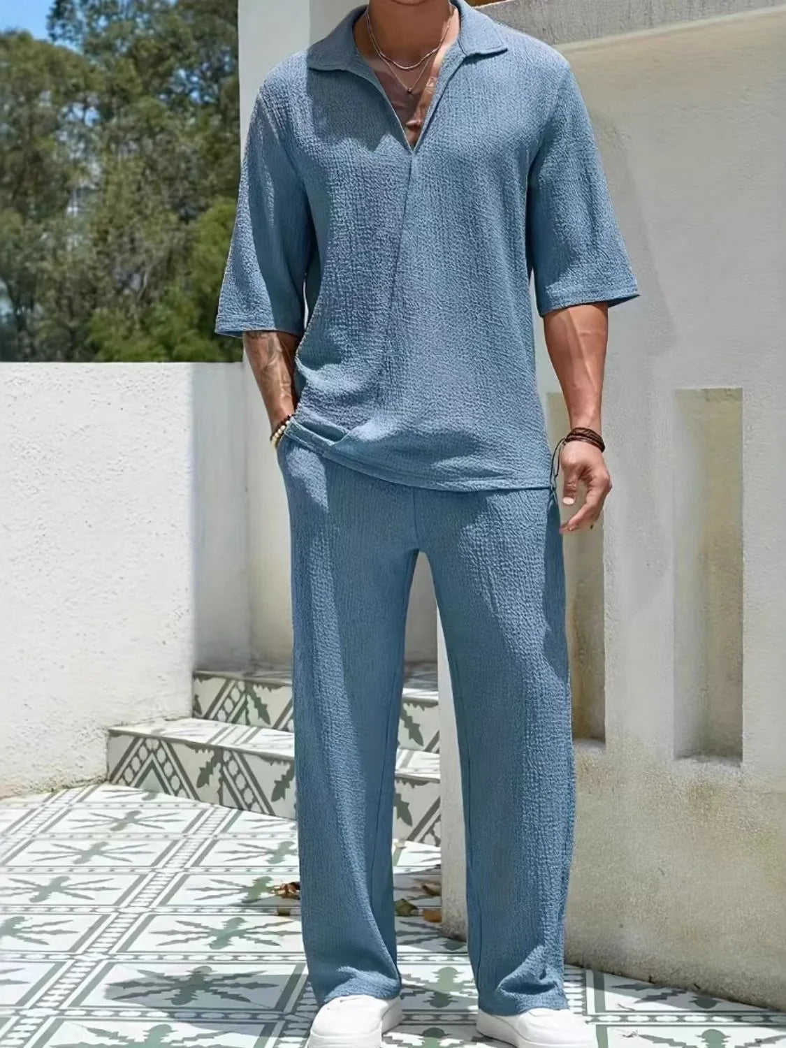 Men's Johnny Collar Half Sleeve Top and Pants Set in blue, outdoor setting.