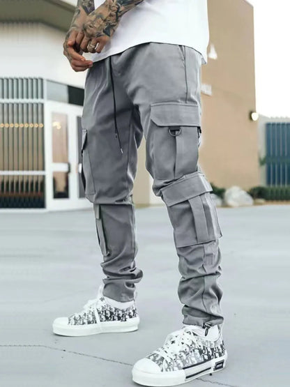 Men's drawstring cargo pants with pockets in a basic style, polyester-spandex blend.