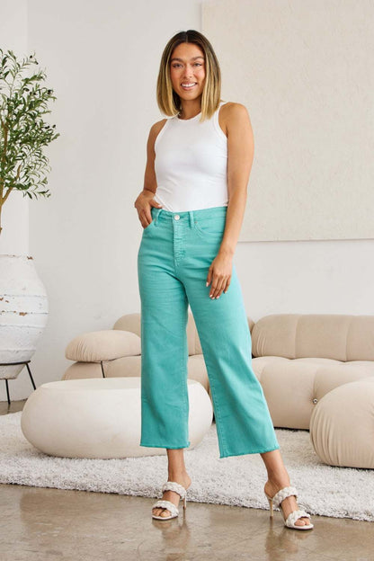 High waist raw hem jeans with tummy control in turquoise, featuring a trendy and modern fit.