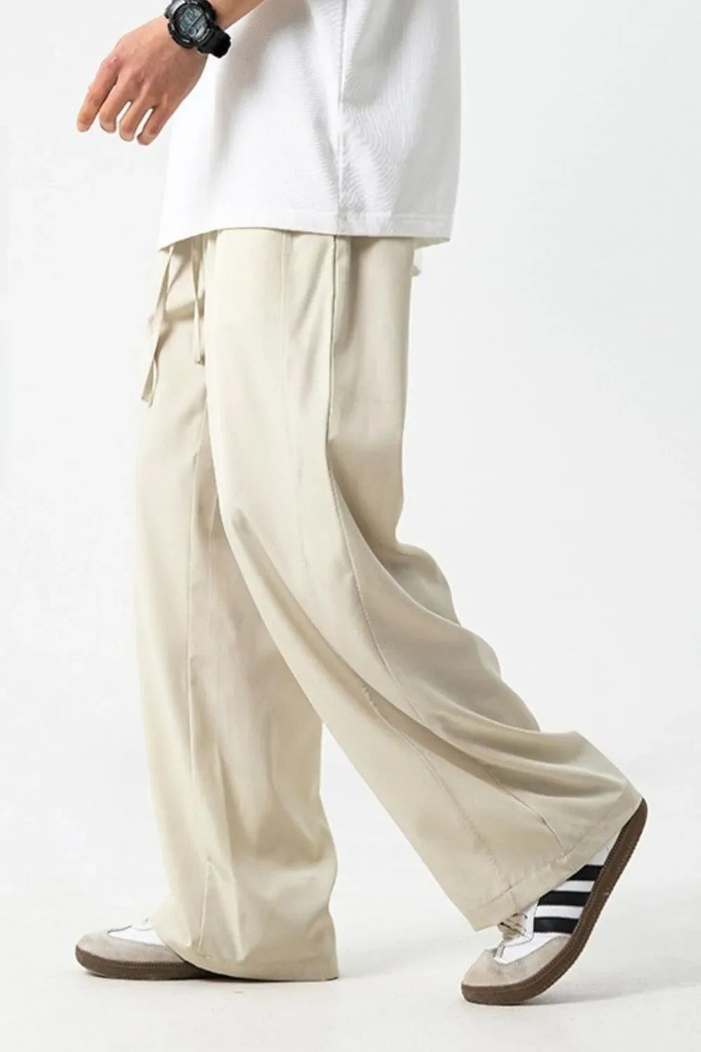 Men's drawstring wide leg pants in beige, made of polyester and spandex.