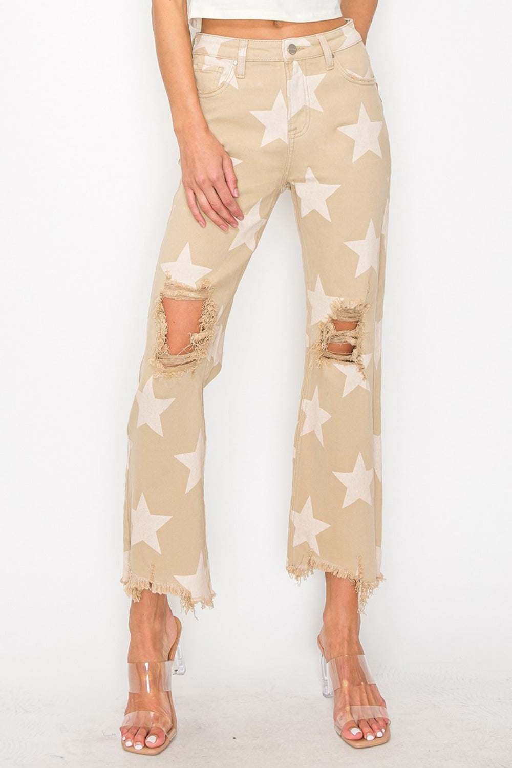 Full size high rise star printed jeans with frayed hem and distressed details.