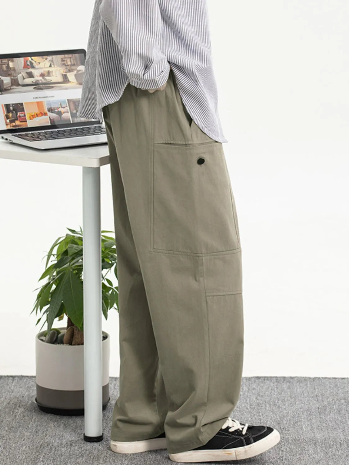 Men's plus size drawstring loose fit pants in khaki, featuring a basic style with side pockets.