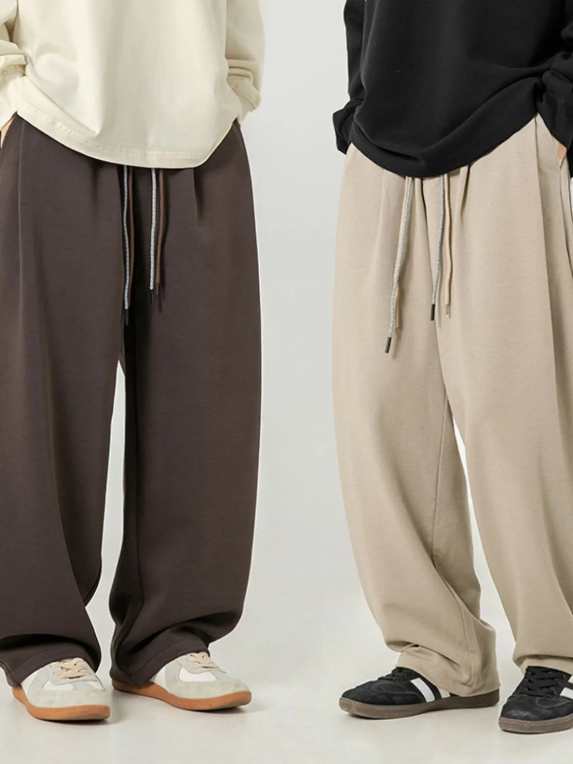 Men's plus size drawstring wide leg pants in dark and light colors.
