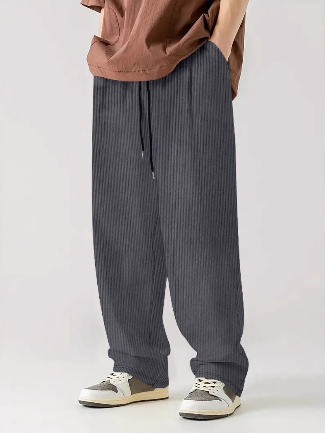 Men's full size drawstring wide leg pants with pockets in dark gray, 100% polyester.