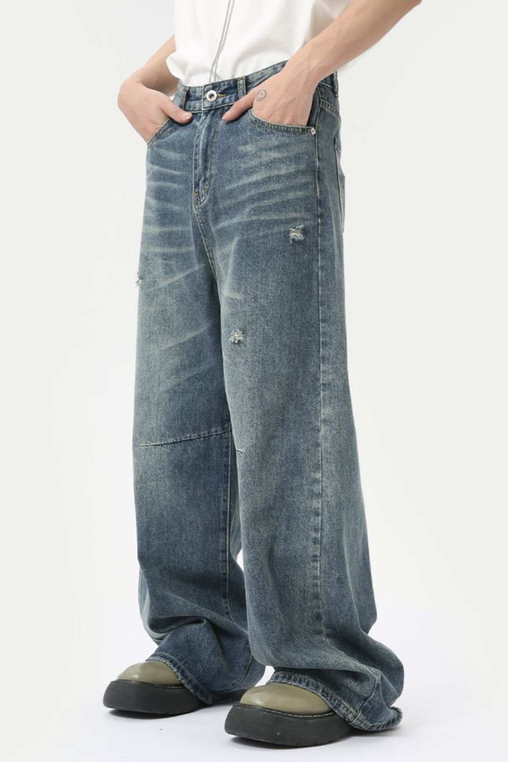 Distressed wide leg men's jeans with pockets in blue, featuring no stretch fabric.