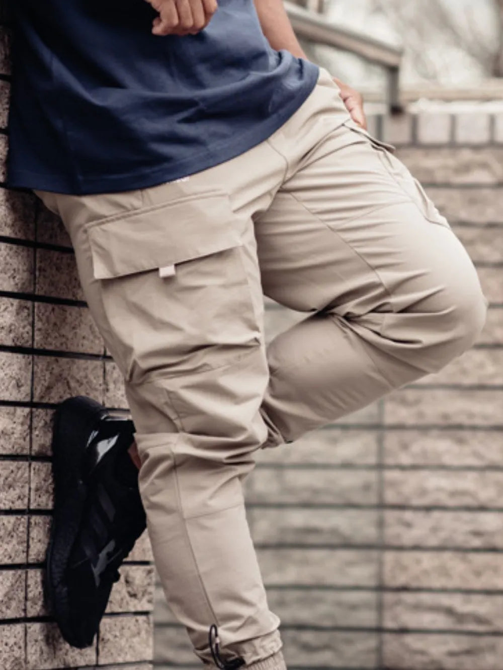 Men's plus size drawstring cargo pants with pockets in beige, polyester-cotton blend.