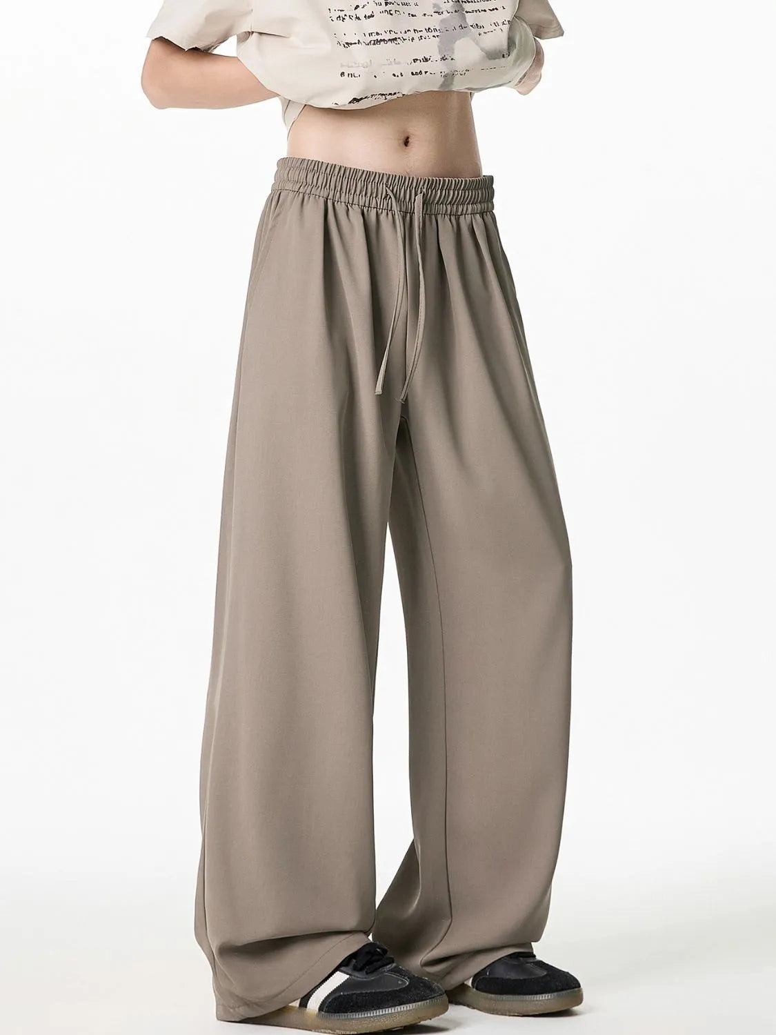 Men's plus size drawstring wide leg pants in beige, made from 100% polyester.