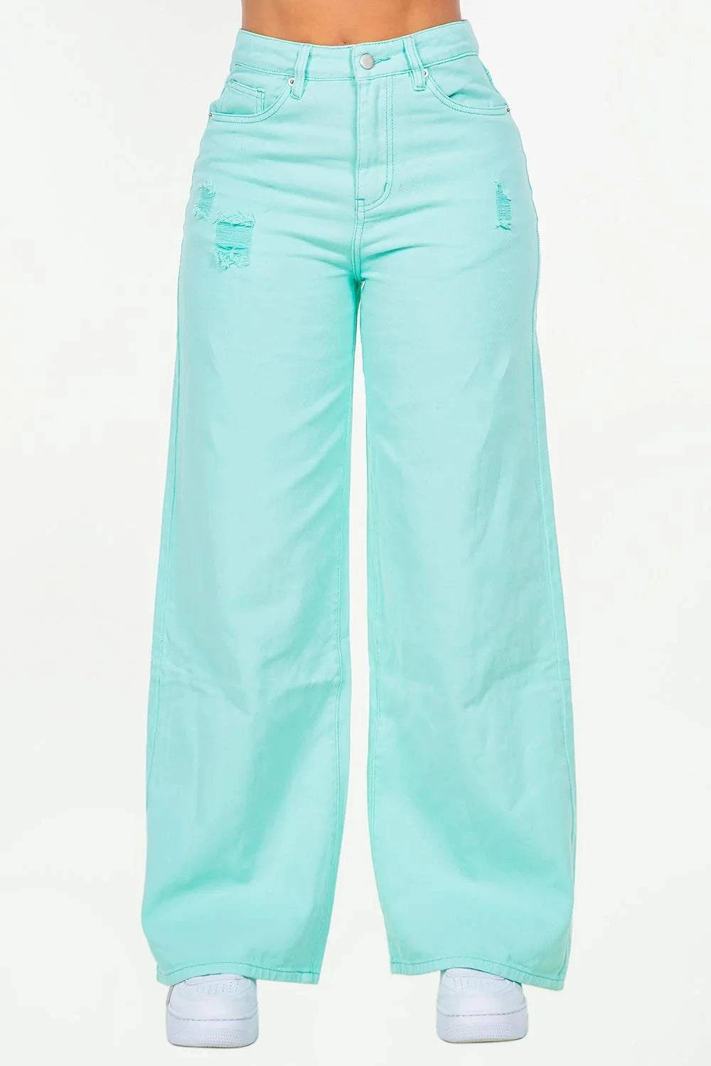 High waist distressed wide leg jeans in light blue with pockets.