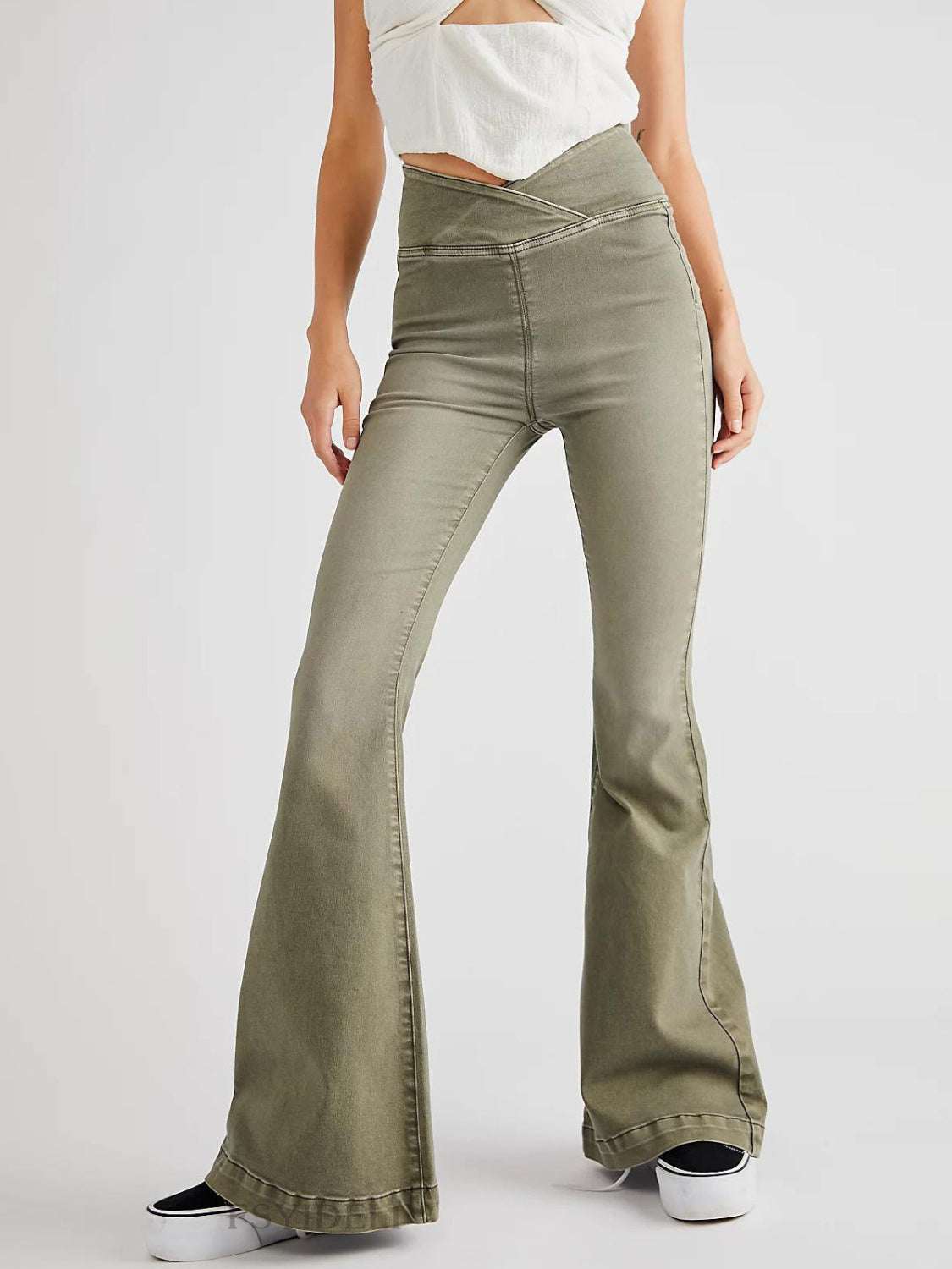 Asymmetric waist flare jeans in green, featuring a basic style with slight stretch and flared legs.