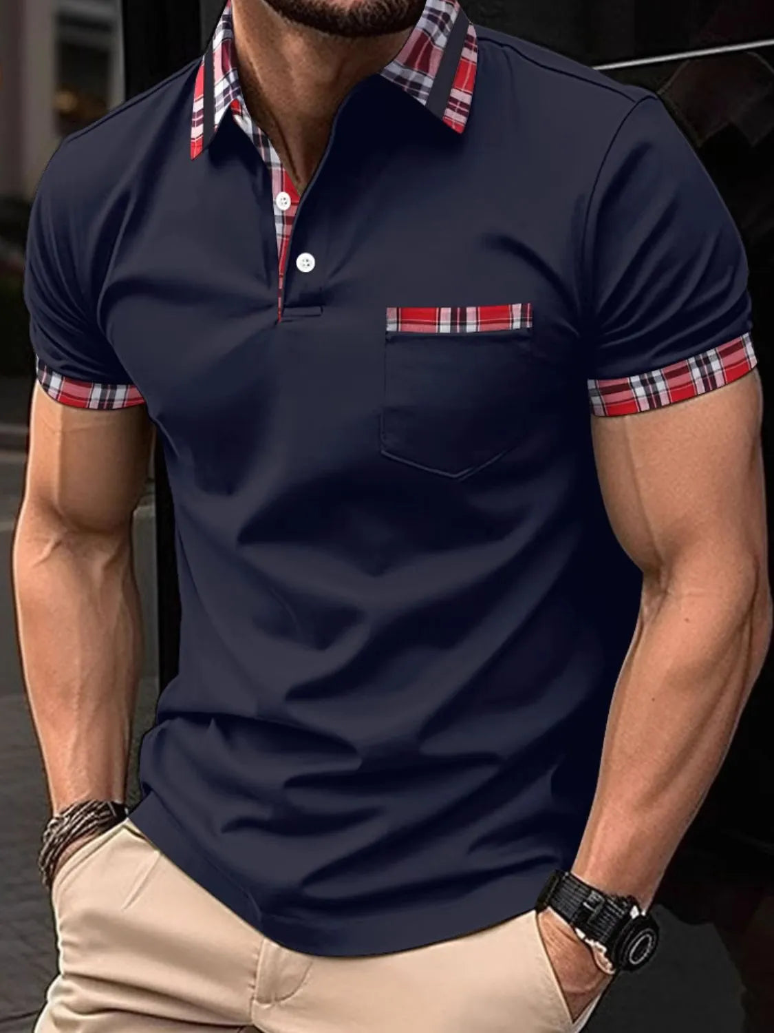 Men's collared neck short sleeve polo with plaid accents and chest pocket.