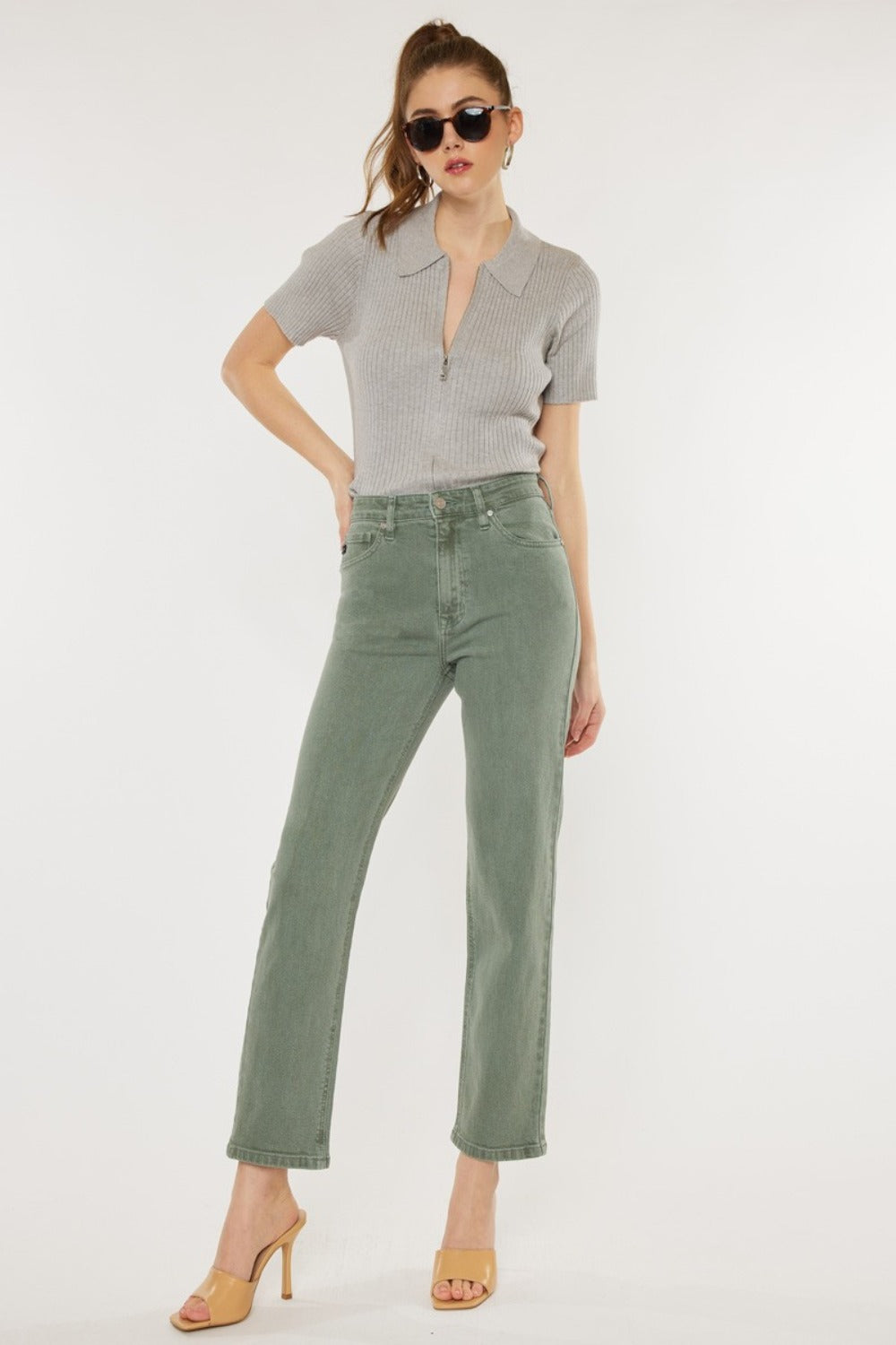 Ultra high rise straight jeans in olive color on model.