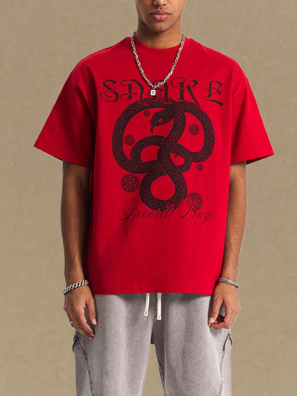 Men's graphic round neck half sleeve red t-shirt with snake design.