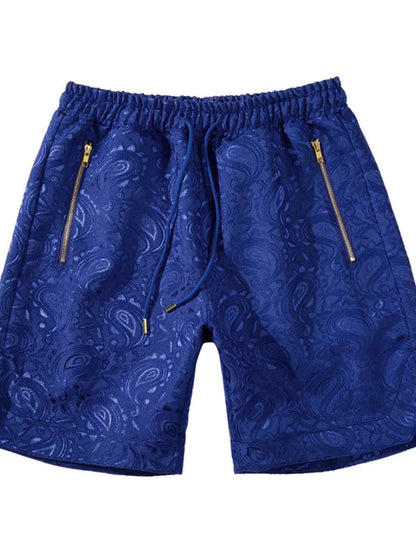 Men's blue drawstring printed shorts with zip pockets.