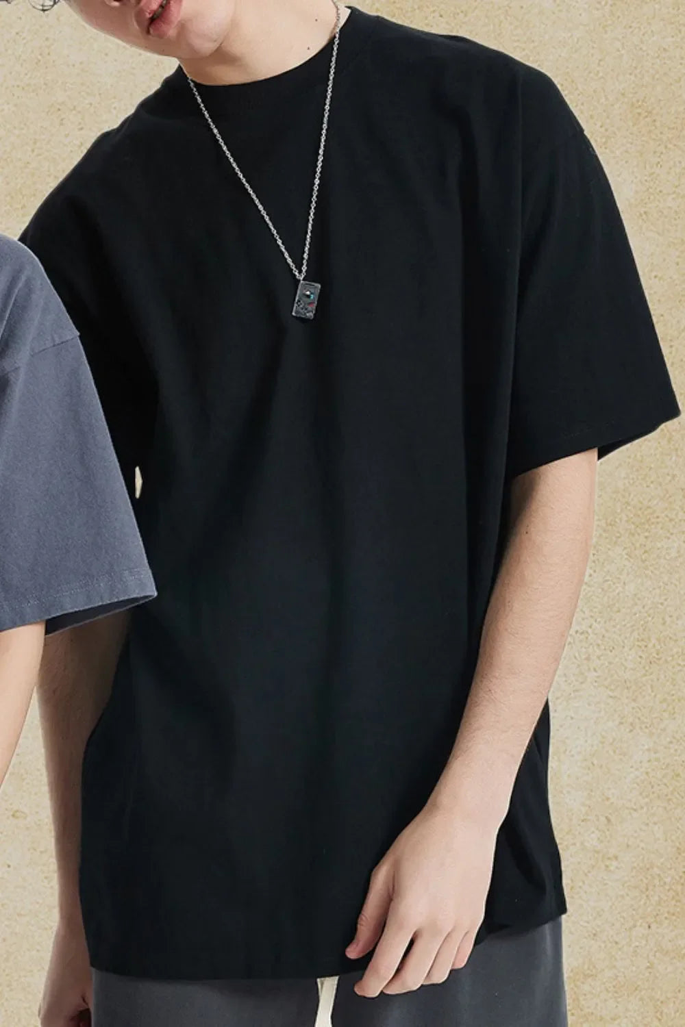 Men's round neck half sleeve t-shirt in black.