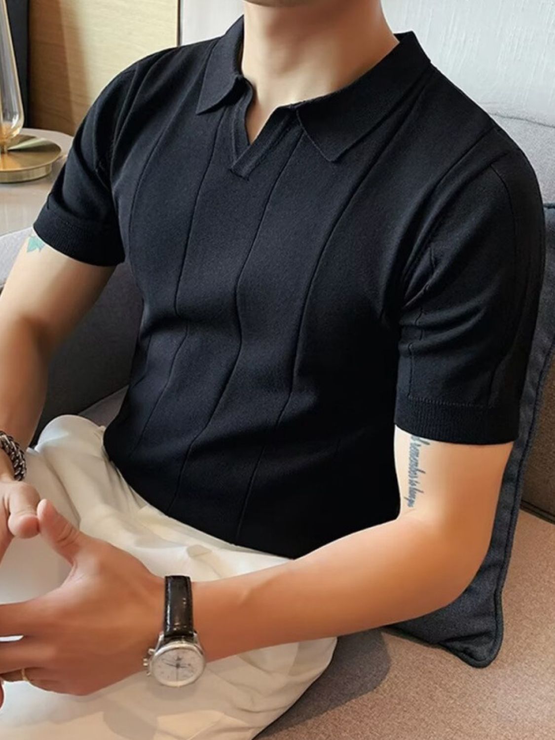 Men's plus size black collared neck short sleeve polo shirt, slightly stretchy cotton blend.
