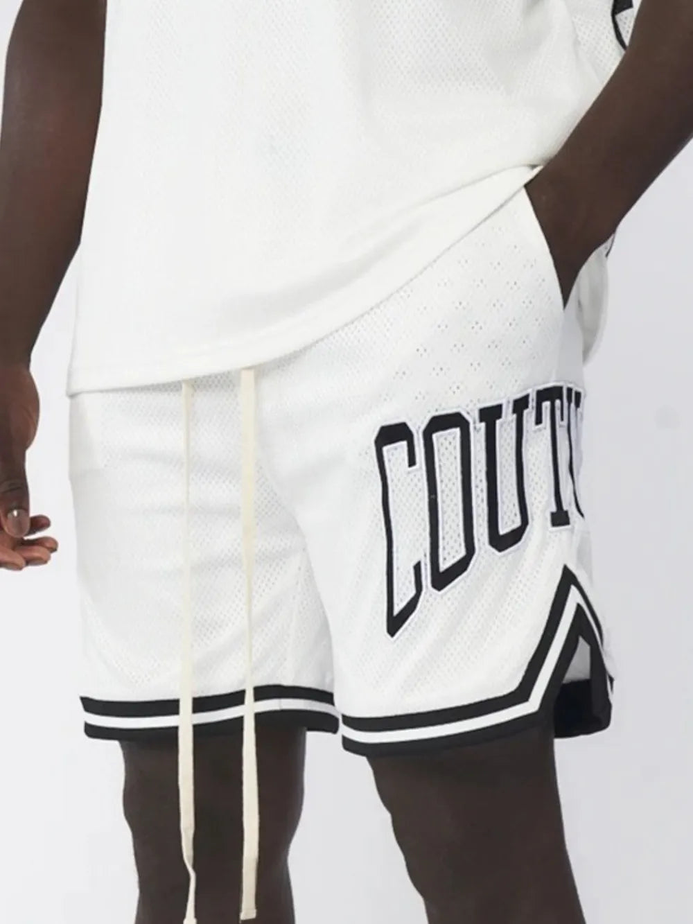 Men's plus size letter drawstring shorts in white with black trim.