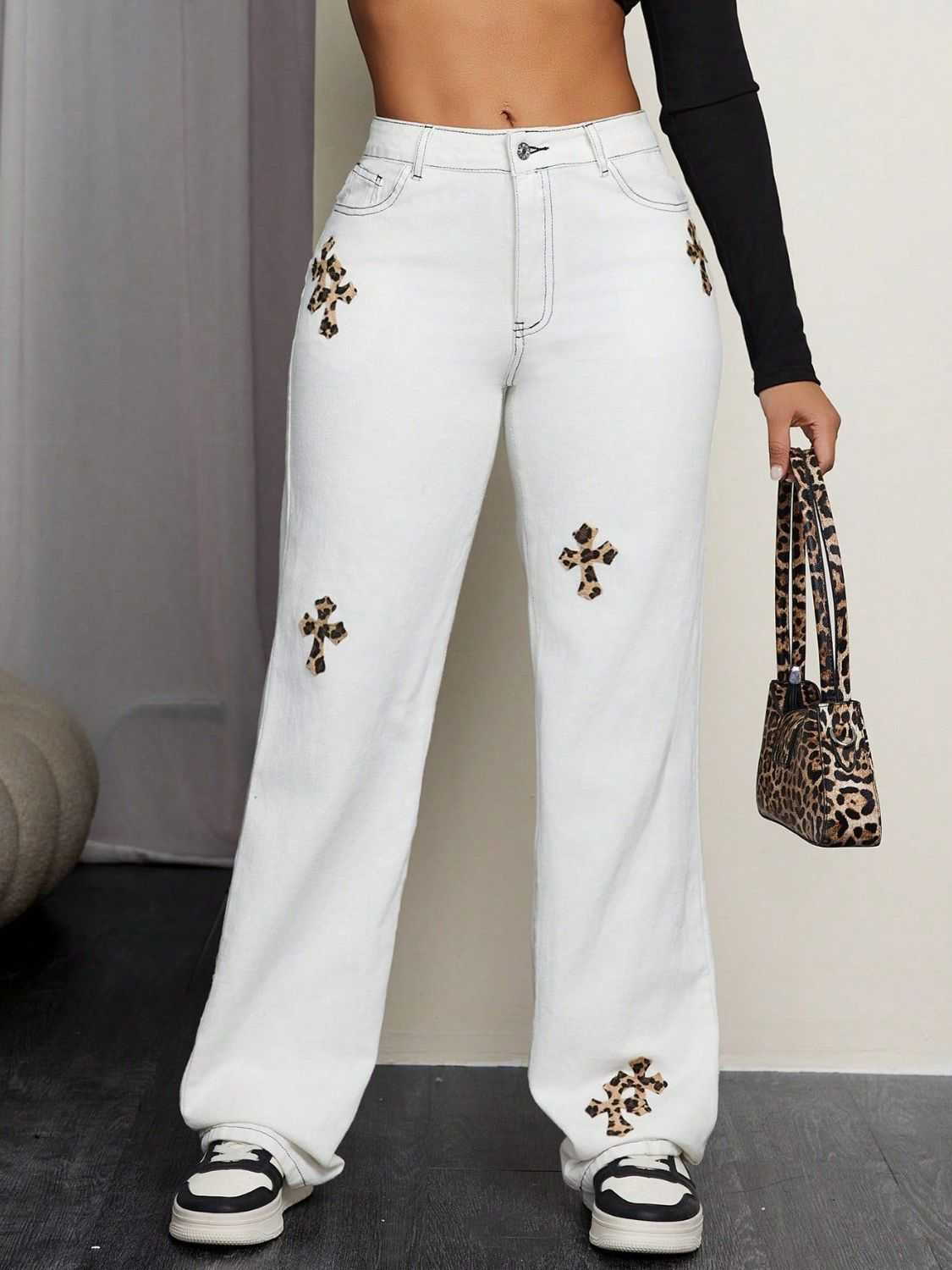 Leopard Cross Detail Straight Leg Jeans with pocketed design and button closure.