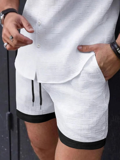 Men's drawstring textured shorts in white with black trim, featuring basic style and comfortable fit.