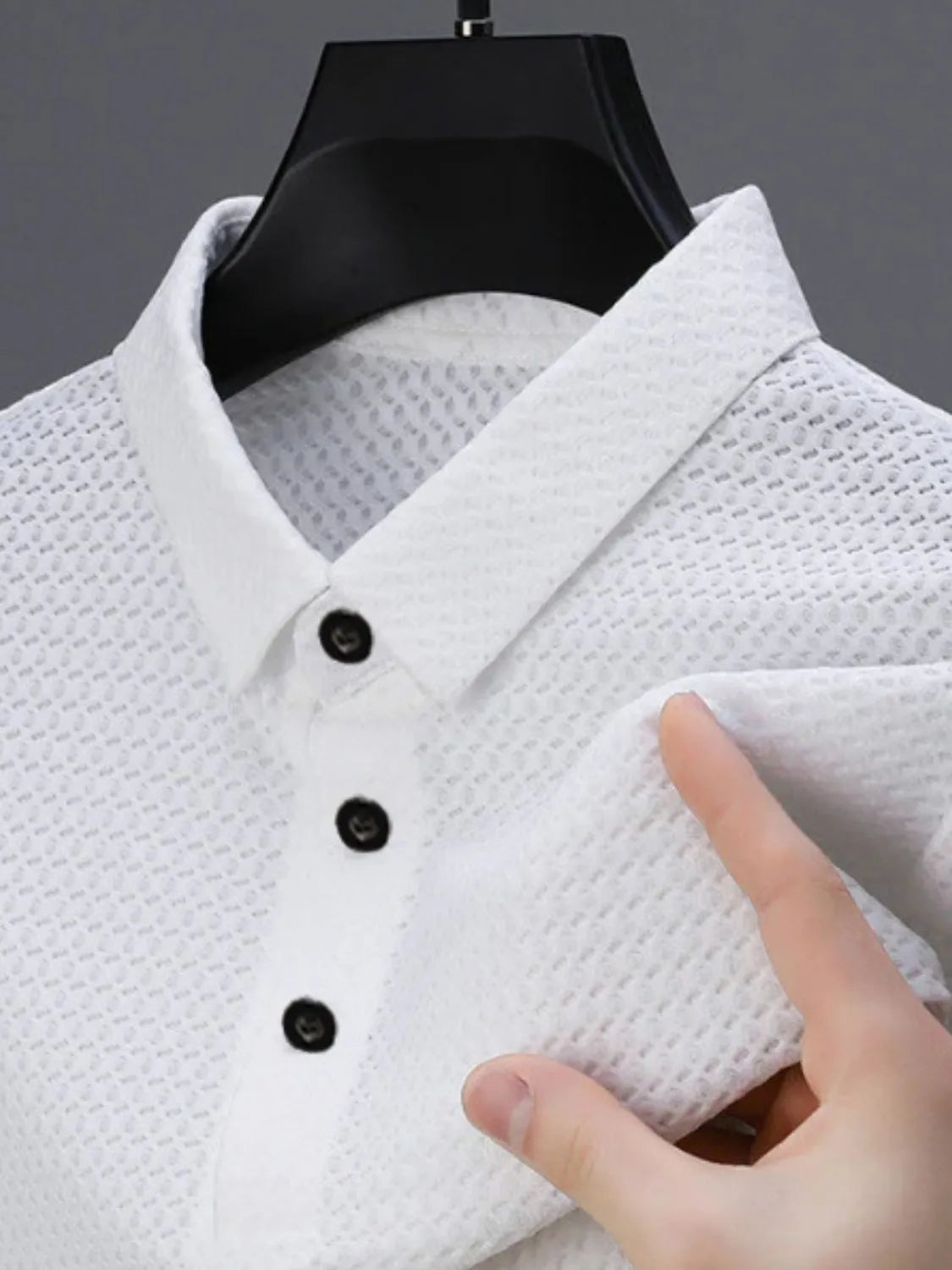 Men's full size collared neck short sleeve polo, waffle-knit fabric, white, button design.