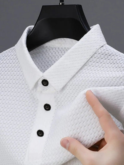 Men's full size collared neck short sleeve polo, waffle-knit fabric, white, button design.