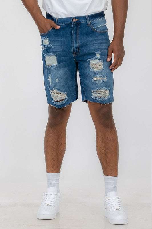 Distressed stretch denim shorts with 10" inseam and slim fit.