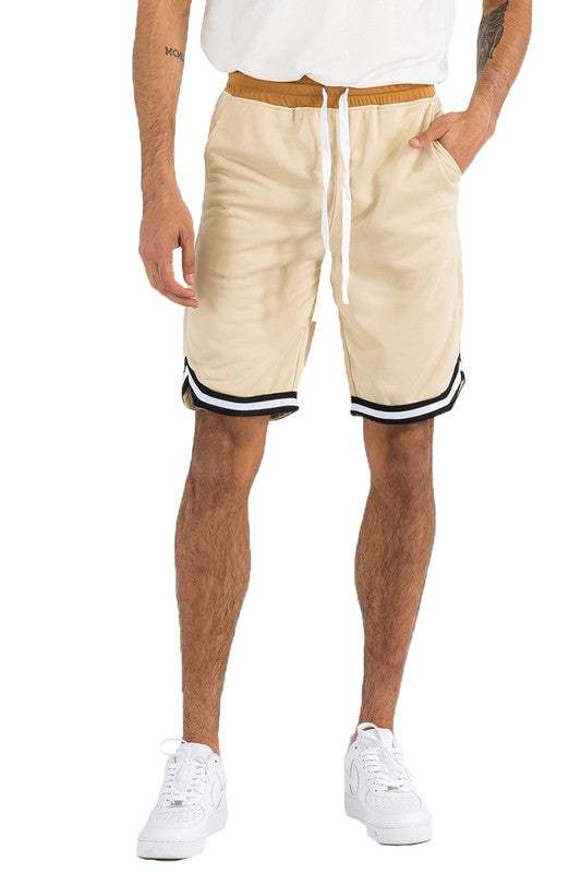 Solid athletic basketball sports shorts with elastic waist and drawstring, featuring standard and single back pocket, in beige color.