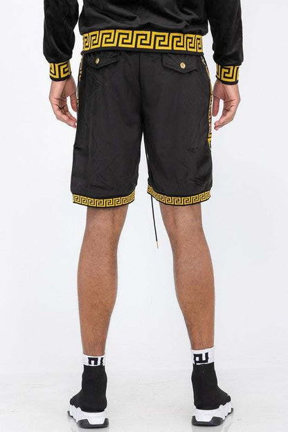Status print velour suede shorts with elastic waistband and drawstring, featuring back button-closure pockets.