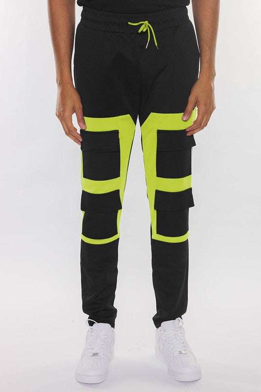 COLOR BLOCK CARGO TRACK PANT with elastic waist and drawstring, featuring velcro closure pouches and back pockets.
